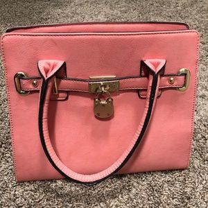 Small pink purse with golf accents